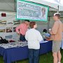 Jim Sweeney and Dorothy Freeman, Jean Sweeney Open Space Park Fund Committee members, talk to a visitor to the booth.